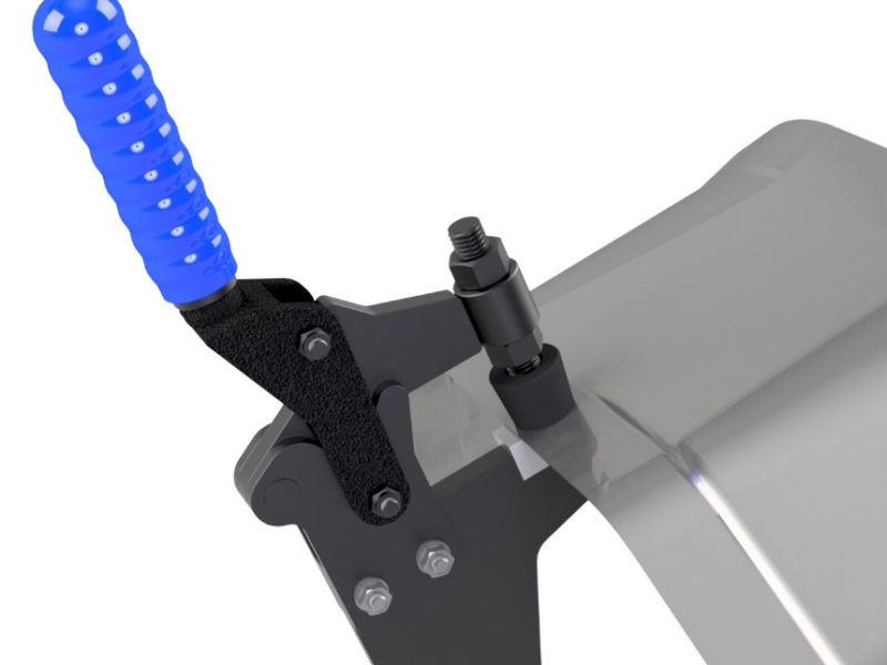 Close up view of a toggle clamp bar tower in use, holding asset of metal with a blue grip
